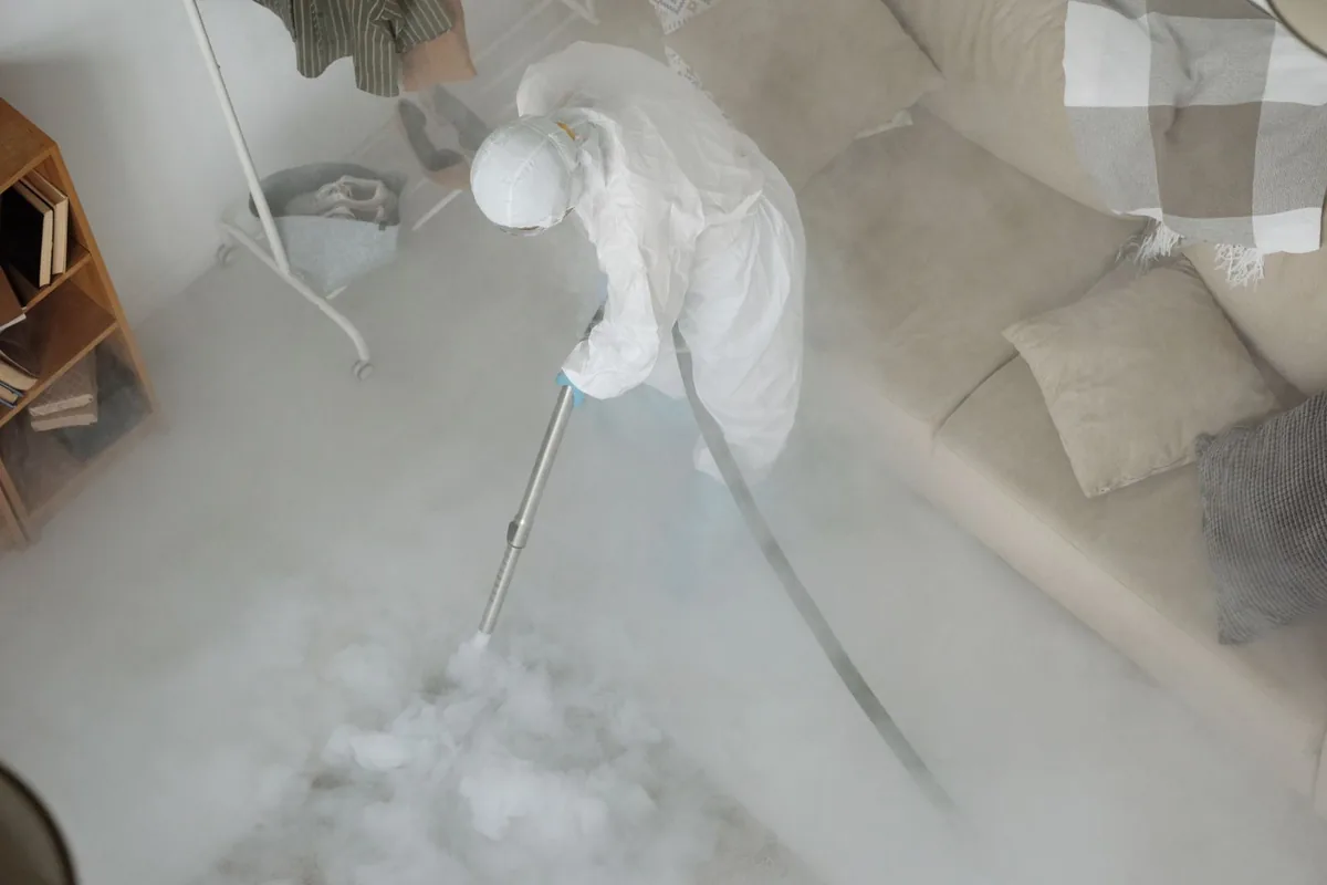 Biohazard cleanup technician in protective equipment, North Division, Milwaukee, WI